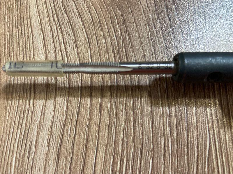 Photo 1 of Klein Tools Triple Tap Tool (Model 625-32), featuring an orange cushion-grip handle and a reversible/replaceable metal tap blade. It is designed for electrical and mechanical work to clean, form, or re-thread screw holes