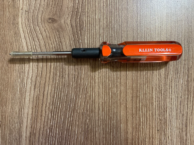 Photo 1 of Klein Tools Triple Tap Tool (Model 625-32), featuring an orange cushion-grip handle and a reversible/replaceable metal tap blade. It is designed for electrical and mechanical work to clean, form, or re-thread screw holes