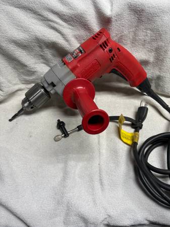 Photo 1 of  Milwaukee Magnum Hole-Shooter 1/2-inch corded drill (Model 0234-1)120 Volts, 60 Hz, 5.5 Amps, single-phase AC/DC.