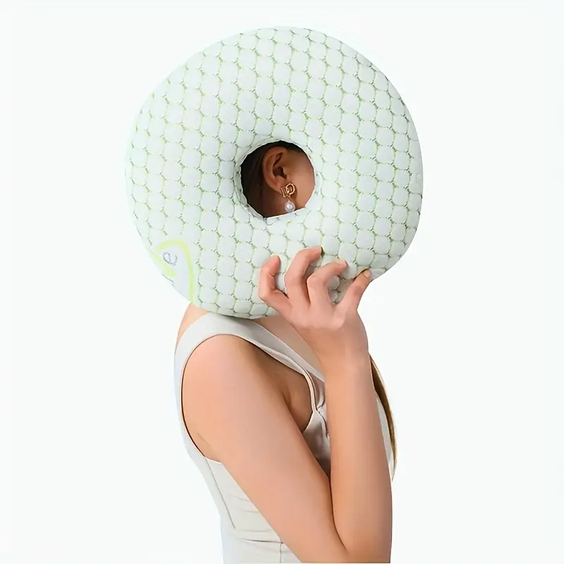 View 1 of donut-shaped ear piercing and pressure relief pillow featuring a textured white bamboo-blend fabric cover.