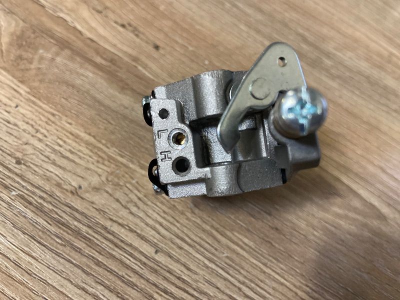 Photo 1 of 2-stroke diaphragm carburetor typically used on small utility engines like the Tecumseh AV520 series for ice augers