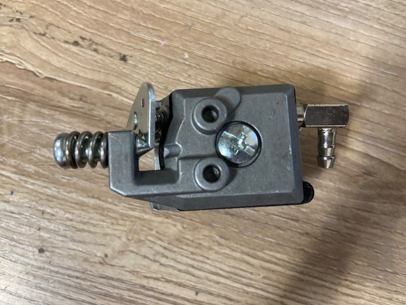Photo 1 of 2-stroke diaphragm carburetor typically used on small utility engines like the Tecumseh AV520 series for ice augers