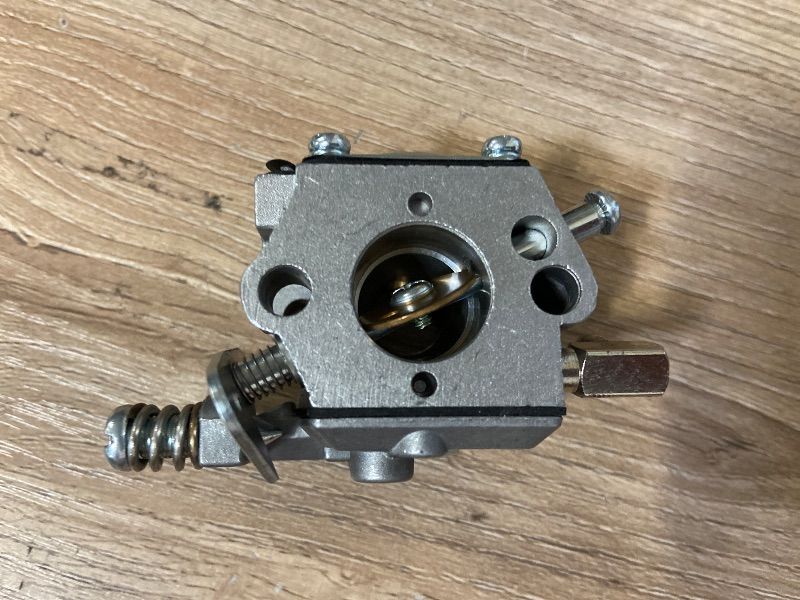 Photo 1 of 2-stroke diaphragm carburetor typically used on small utility engines like the Tecumseh AV520 series for ice augers