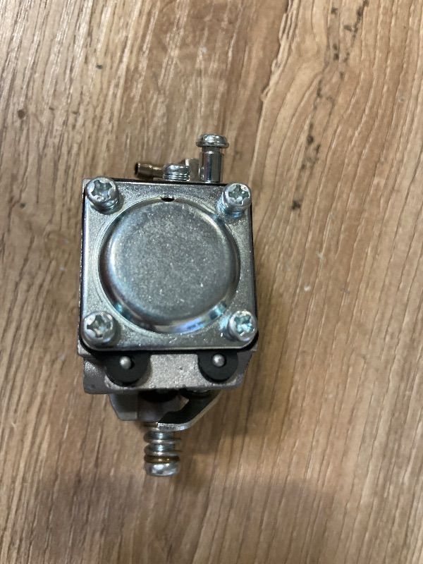 Photo 1 of 2-stroke diaphragm carburetor typically used on small utility engines like the Tecumseh AV520 series for ice augers