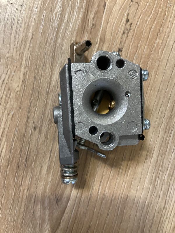 Photo 1 of 2-stroke diaphragm carburetor typically used on small utility engines like the Tecumseh AV520 series for ice augers