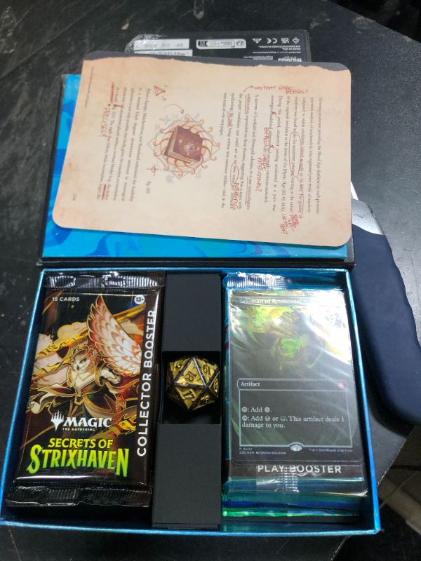 Photo 1 of Magic: The Gathering Secrets of Strixhaven - Codex Bundle (2 Collector Boosters, 6 Play Boosters, 2 Foil Promo Cards, 20 Foil Lands, 1 Spindown)