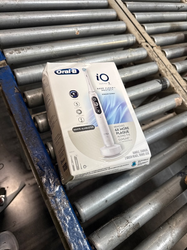 Photo 1 of [HEAVILY USED] Oral-B Rechargeable Electric Toothbrush, iO7 Limited Deep Clean + Protect, 5 Cleaning Modes, Interactive Display, Visible Pressure Sensor, 2 Brush Heads, Charging Travel Case, White