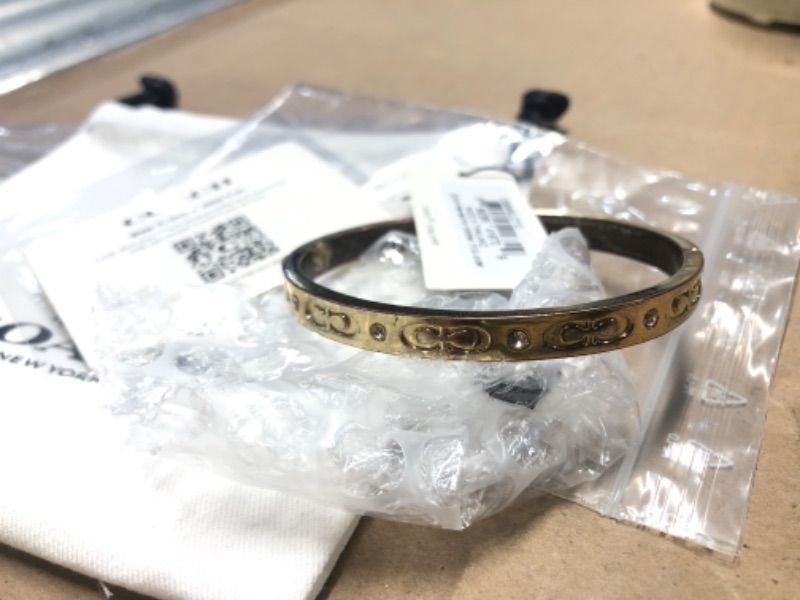 Photo 1 of ***STOCK PHOTO FOR REFERENCE ONLY, CLASP HAS BEEN GLUED*** COACH Pegged C Logo Hinged Bangle Bracelet Shiny Gold One Size