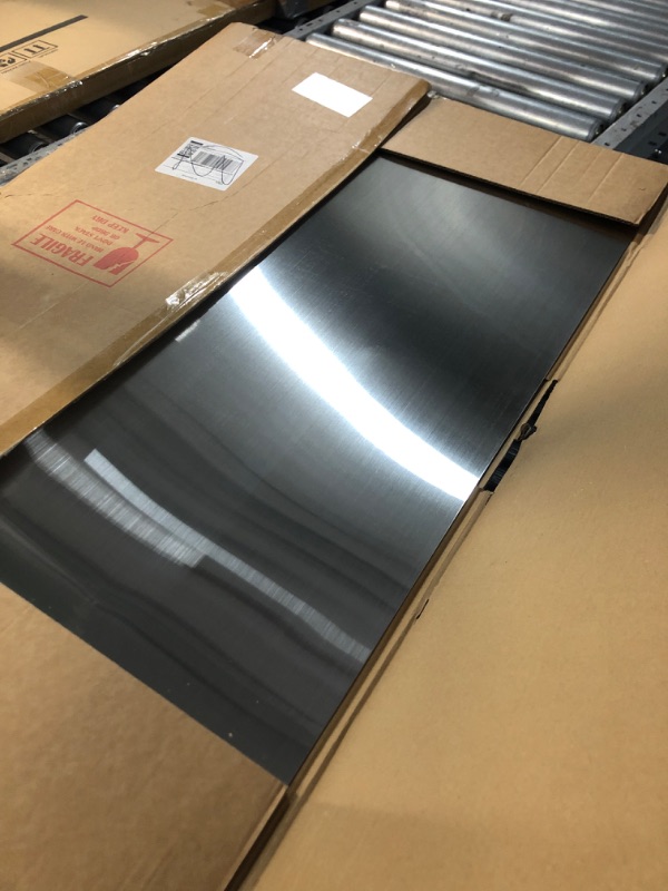 Photo 1 of ****Minor damage****24" x 36" Reversible Metal Backsplash Matching screws | Compatible with Broan-NuTone SP3004 - Ultra Flat and Flushed Metal Panel Splatter Guard for Stovetop Easy Installation
