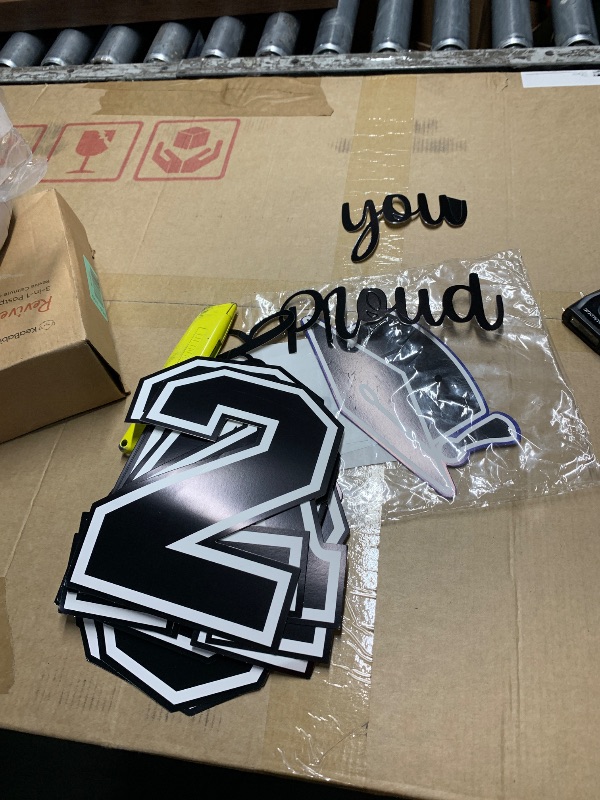 Photo 1 of ***STOCK PHOTO FOR REFERENCE ONLY**Graduation Decorations 2026 - Class of 2026 Party Supplies Kit with Pre-Strung Black and Gold Glitter "We Are So Proud of You" Banner & Congrats Grad Cutouts Signs for High School, College, Home & Car