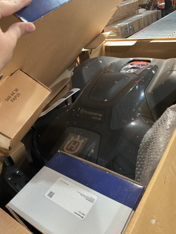 Photo 1 of ***EXTREMELY FIRTY AND USED***Husqvarna Automower 410iQ Robotic Mower, 0.5 Acre Mowing Capacity, Wire Free Robot Lawn Mower with Charging Station, RS1 EPOS Reference Station and Replacement Blades