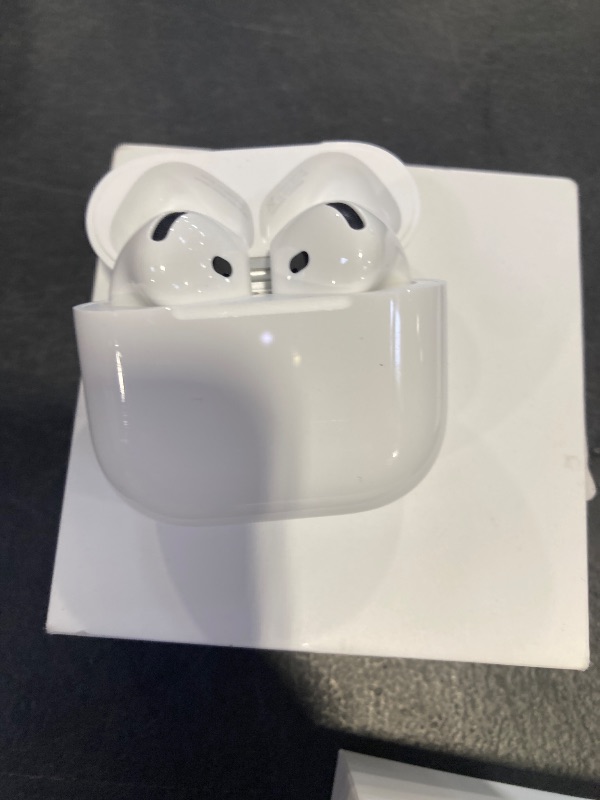 View 4 of Apple AirPods 4 Wireless Earbuds, Bluetooth Headphones, Personalized Spatial Audio, Sweat and Water Resistant, USB-C Charging Case, H2 Chip, Up to 30 Hours of Battery Life, Effortless Setup for iPhone
