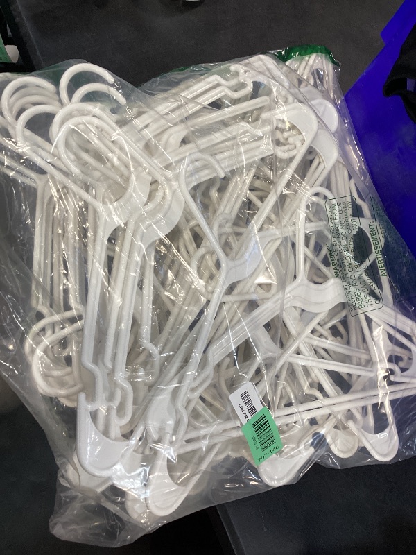 Photo 1 of Amazon Basics Space Saving Plastic Clothes Hangers, Sturdy Closet Organizer for Shirts and Jackets, Adult Size, White, 50-Pack