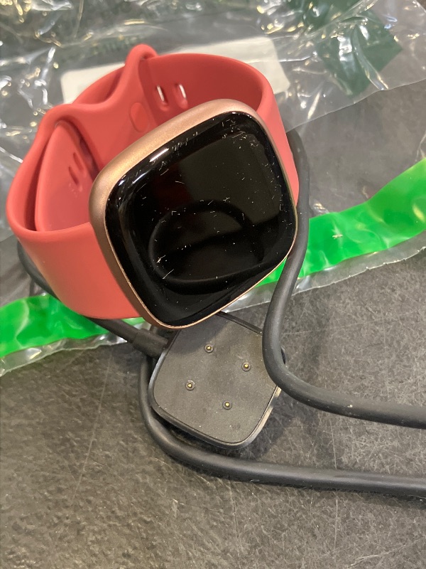 Photo 1 of Fitbit Versa 4 Smartwatch - Pink Sand/Copper Rose