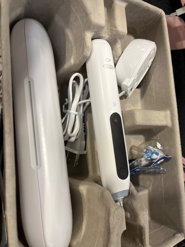 Photo 1 of Oral-B Rechargeable Electric Toothbrush, iO5 Customizable Clean, 5 Cleaning Modes, Visual Pressure Sensor to Protect Gums, Travel Case, White