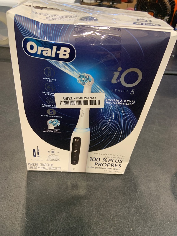 Photo 1 of Oral-B Rechargeable Electric Toothbrush, iO5 Customizable Clean, 5 Cleaning Modes, Visual Pressure Sensor to Protect Gums, Travel Case, White