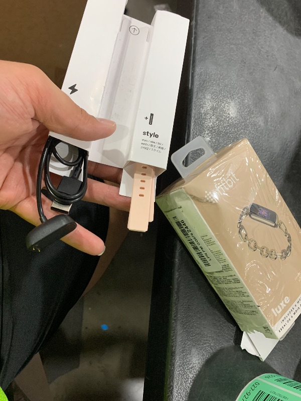 Photo 1 of Retail $20.00 Fitbit charger and band)