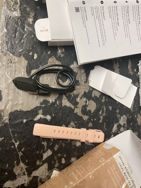 Photo 1 of Retail $20.00 Fitbit charger and band)