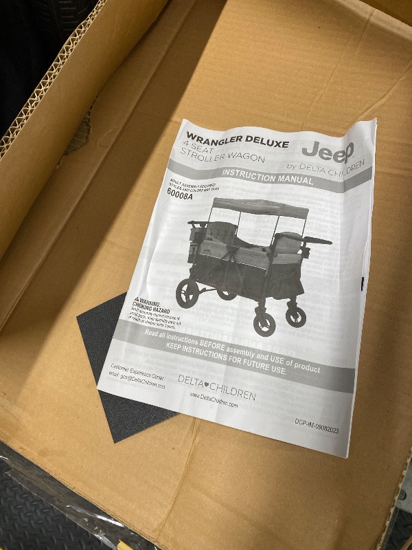 Photo 1 of *Used* Jeep Wrangler Deluxe 4 Seater Stroller Wagon by Delta Children - Premium Quad Stroller Wagon for 4 Kids with Convertible Seats, Adjustable Push/Pull Handles, Removable Canopy & Flat Fold, Grey