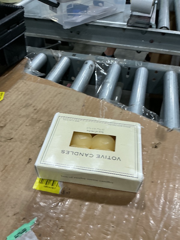 View 2 of [Deformed from Heat, missing candles] Light In The Dark French Vanilla Votive Candles, Set of 12
