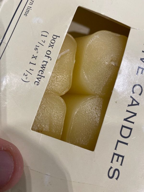 View 3 of [Deformed from Heat, missing candles] Light In The Dark French Vanilla Votive Candles, Set of 12