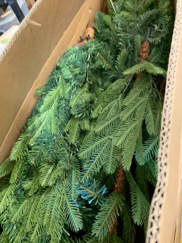 Photo 1 of National Tree Company 7.5 ft Unlit Norwegian Spruce Artificial Christmas Tree, 1,325 Tips, Includes Stand, Green