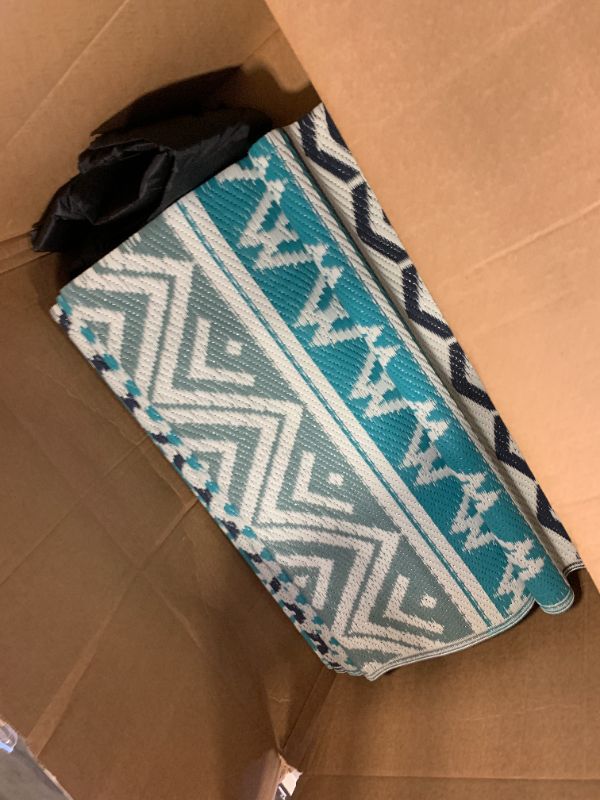 Photo 1 of MontVoo Outdoor Rug Carpet Waterproof-Patio Rug Mat 10x14 Reversible RV Outdoor Camping Rugs Picnic Beach Mats Plastic Straw Outside Rugs for Balcony Porch Pool Deck Boho Patio Decor