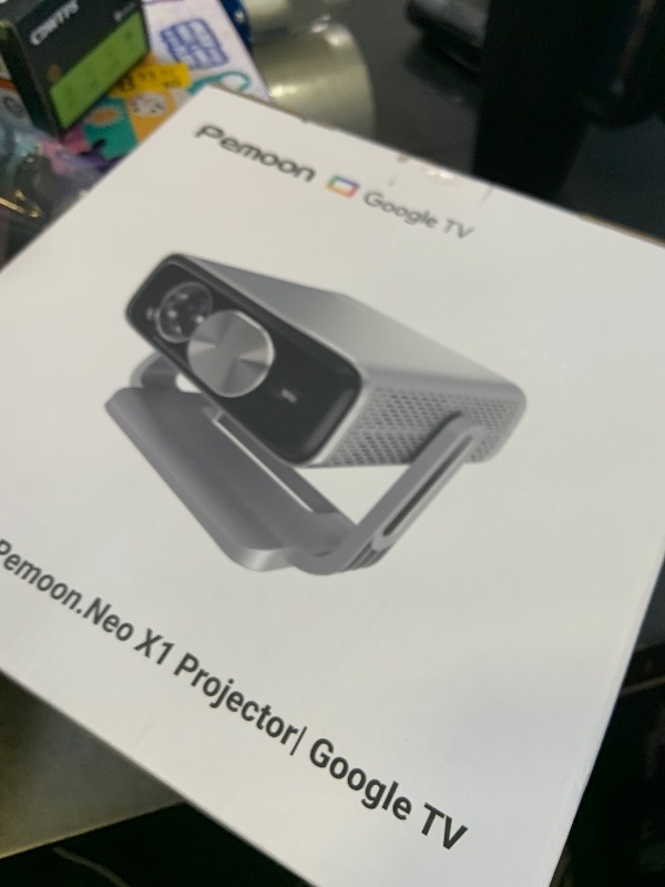 Photo 1 of Smart 4K Projector [Bundled with Google TV Stick] with WiFi and Bluetooth, 2500ANSI, Auto Lens Cap, Portable Outdoor Movie Projector with Built-in Apps Auto Focus for Ceiling/Home Theater/Bedroom