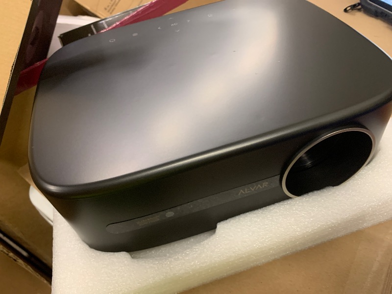 Photo 1 of Alvar Smart Projector 2026 Upgrade, 2000 ANSI, 4K Supported, NetfIix Certified, DoIby Audio & 50W Speakers, Auto Focus & Keystone, WiFi 6, Bluetooth 5.3, Home Theater & Outdoor Movie Projector, Black