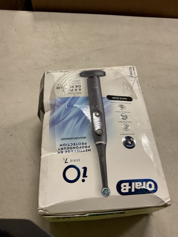 Photo 1 of Oral-B iO Deep Clean + Protect Rechargeable Electric Toothbrush, Black, iO Series 7, 2 Replacement Brush Heads, Charging Travel Case (package may vary)