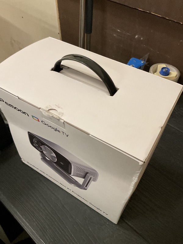 Photo 1 of Smart 4K Projector [Bundled with Google TV Stick] with WiFi and Bluetooth, 2500ANSI, Auto Lens Cap, Portable Outdoor Movie Projector with Built-in Apps Auto Focus for Ceiling/Home Theater/Bedroom