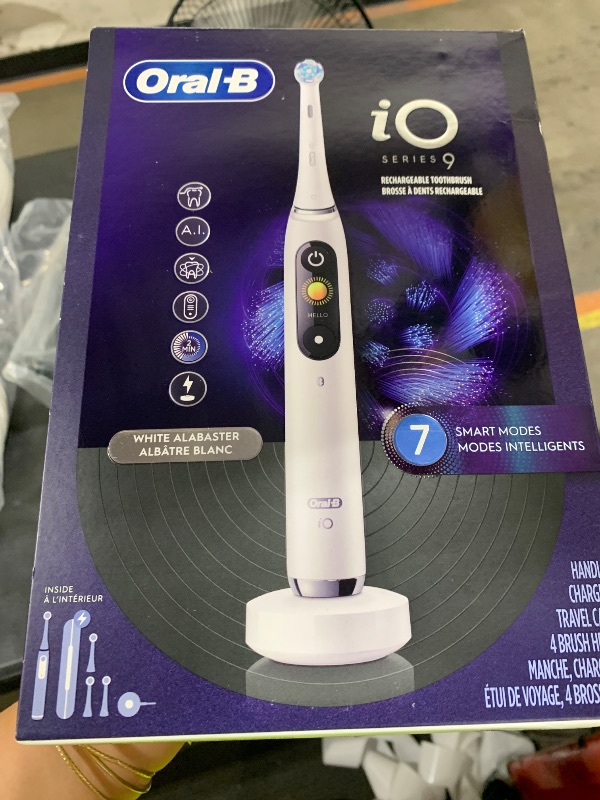 Photo 1 of Oral-B Rechargeable Electric Toothbrush, iO9 Genius, 7 Cleaning Modes, Interactive Display, Charging Travel Case, Visible Pressure Sensor, 4 Brush Heads, White Alabaster