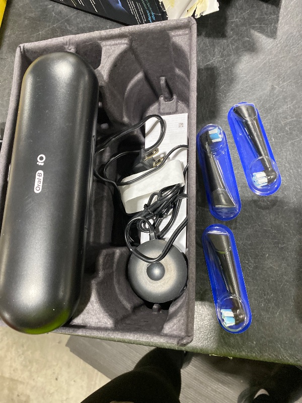 Photo 1 of Oral-B Rechargeable Electric Toothbrush, iO9 Limited Ultimate Clean, 7 Cleaning Modes, Interactive Display, iSense Charger, Charging Travel Case, Visible Pressure Sensor, 3 Brush Heads, Black