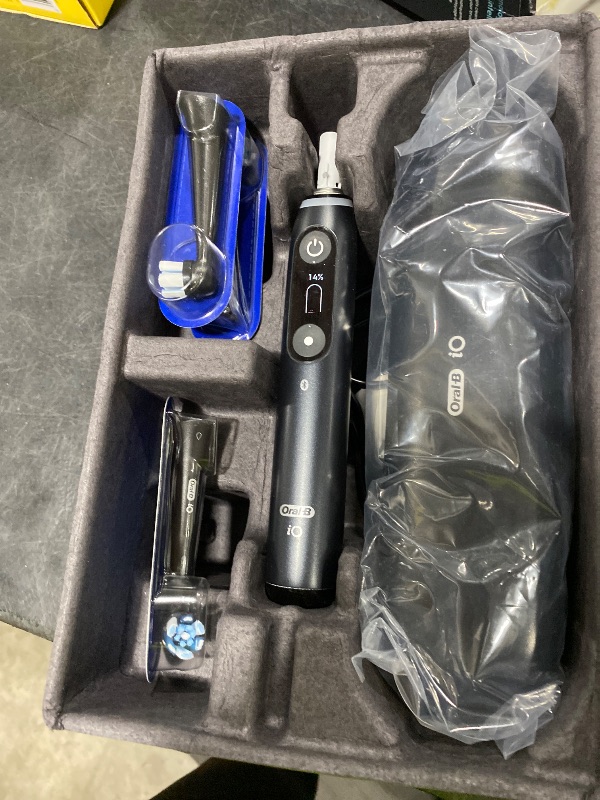 Photo 1 of Oral-B Rechargeable Electric Toothbrush, iO9 Limited Ultimate Clean, 7 Cleaning Modes, Interactive Display, iSense Charger, Charging Travel Case, Visible Pressure Sensor, 3 Brush Heads, Black