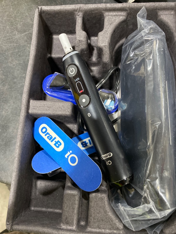 Photo 1 of Oral-B Rechargeable Electric Toothbrush, iO9 Limited Ultimate Clean, 7 Cleaning Modes, Interactive Display, iSense Charger, Charging Travel Case, Visible Pressure Sensor, 3 Brush Heads, Black