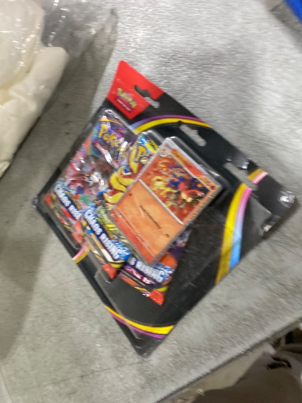 Photo 1 of Pokémon TCG: Mega Evolution—Chaos Rising Triple Pack (1 Foil Promo Card & 3 Booster Packs)
