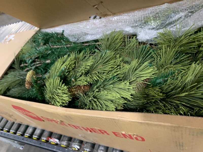 Photo 1 of National Tree Company 4.5 ft Pre-Lit Downswept Douglas Fir Slim Artificial Christmas Tree, 300 LED Lights, 640 Tips, PowerConnect, Foot Pedal, 10 Light Functions, Includes Stand, Green