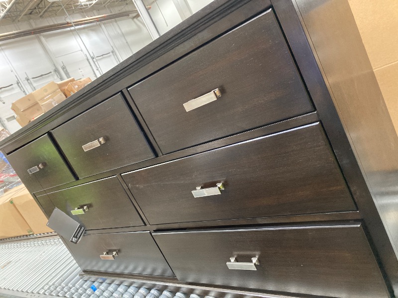 View 2 of **he's bald and missing a leg***Signature Design by Ashley Covetown 7 Drawer Dresser, Dark Brown