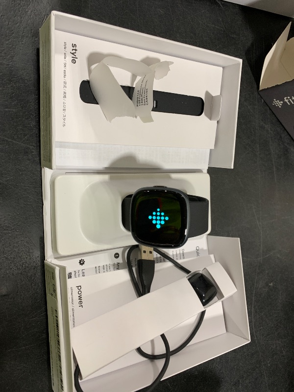 Photo 1 of Fitbit Versa 4 Smartwatch - Black/Graphite