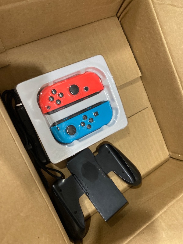 Photo 1 of Nintendo Switch with Neon Blue and Neon Red Joy-Con - Handheld Gaming Console