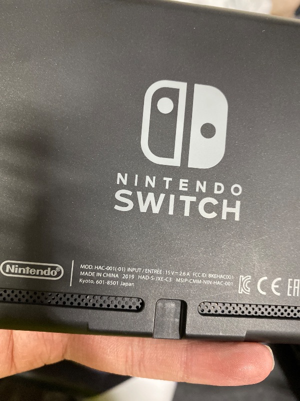 Photo 1 of Nintendo Switch with Neon Blue and Neon Red Joy-Con - Handheld Gaming Console