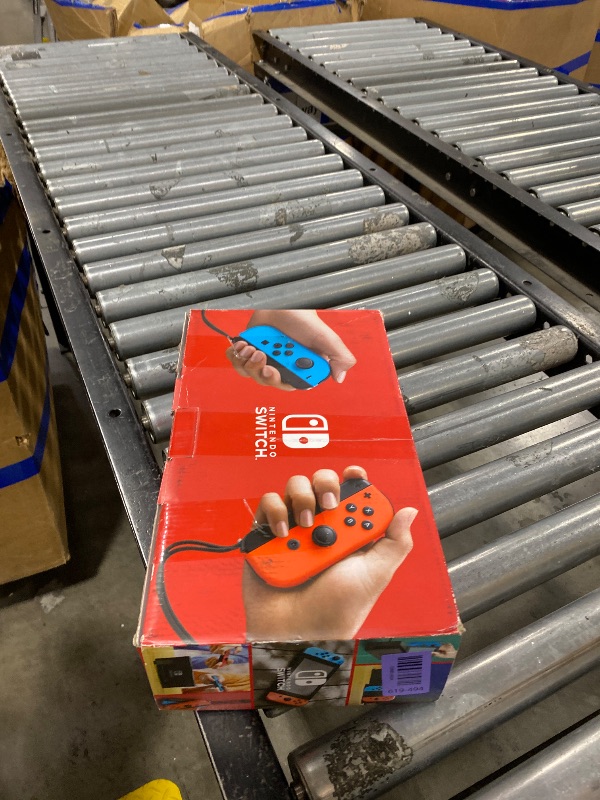 View 2 of Nintendo Switch Console with Neon Blue and Red Joy-Con