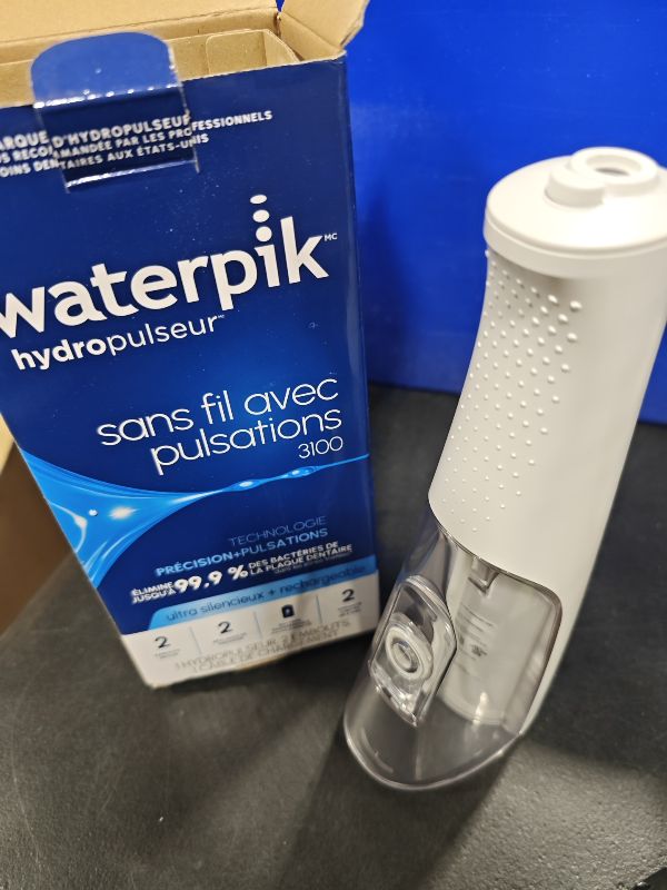 Photo 1 of Waterpik Cordless Pulse 3100 Portable Water Flosser, Rechargeable, White