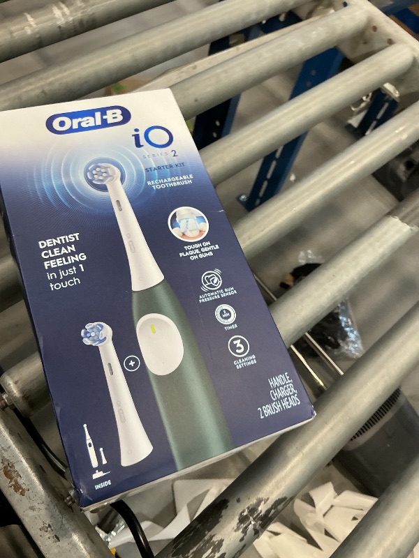 Photo 1 of Oral-B Rechargeable Electric Toothbrush, iO2 Starter Kit, 3 Cleaning Modes, Automatic Pressure Sensor to Protect Gums, 2 Brush Heads, Forest Green