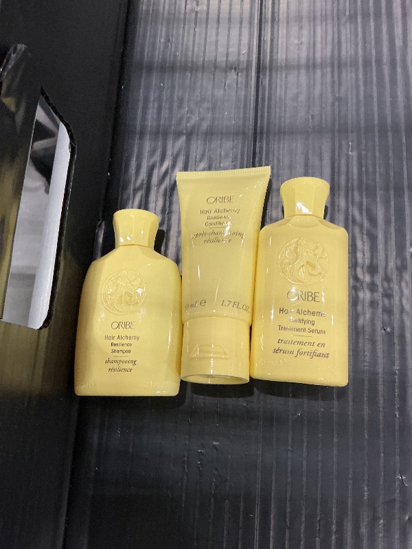 Photo 1 of Oribe Hair Alchemy Travel Set - Strengthening Shampoo, Conditioner & Serum