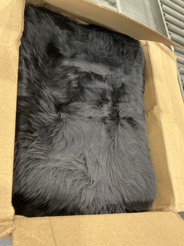 Photo 1 of HUAHOO Premium Genuine Sheepskin Rug Black Real Australia Sheepskin Natural Luxury Fluffy Lambskin Fur Area Rug Seat Covers for Kids Bedroom Sofa Chair Cover Pets Dogs Mat Quarto Pelt/4' x 6' Black