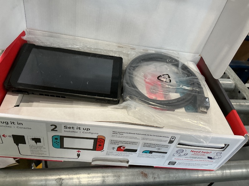 Photo 1 of Nintendo Switch Console with Neon Blue and Red Joy-Con