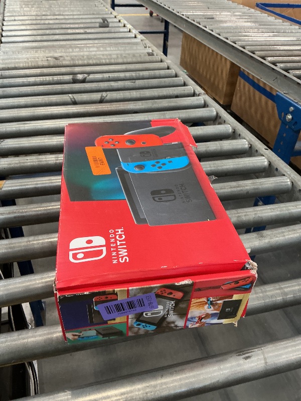 Photo 1 of Nintendo Switch Console with Neon Blue and Red Joy-Con