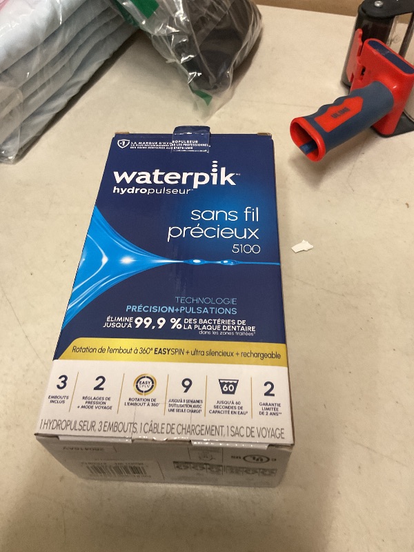 View 2 of Waterpik Cordless Gem 5100 Portable Water Flosser, Rechargeable, Blue