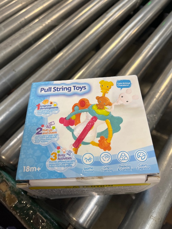 View 2 of Taotaotoys Baby Travel Toy with Silicone Pull String Sensory Features